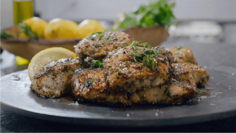 A plated grilled chicken meal.