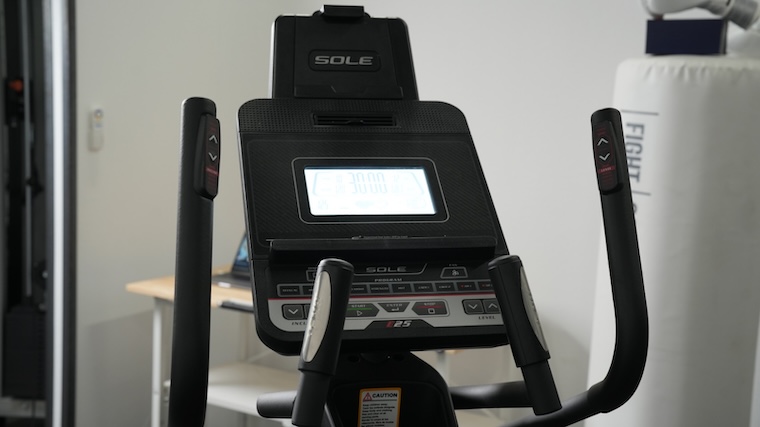 Sole E25 elliptical center console and integrated tablet holder.