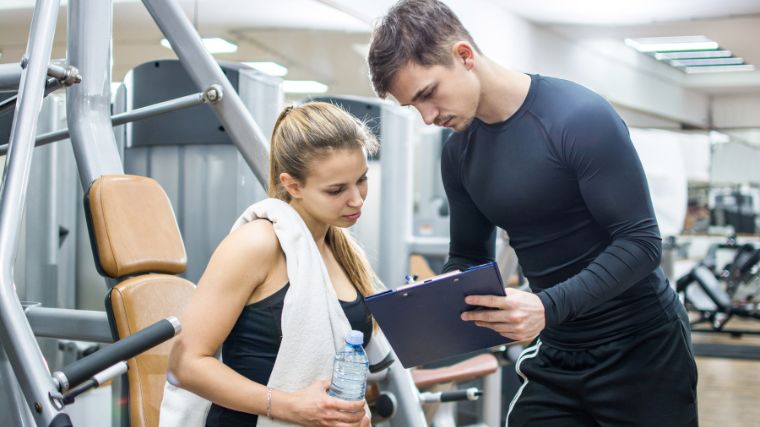 A person with a coach planning their weight loss management.